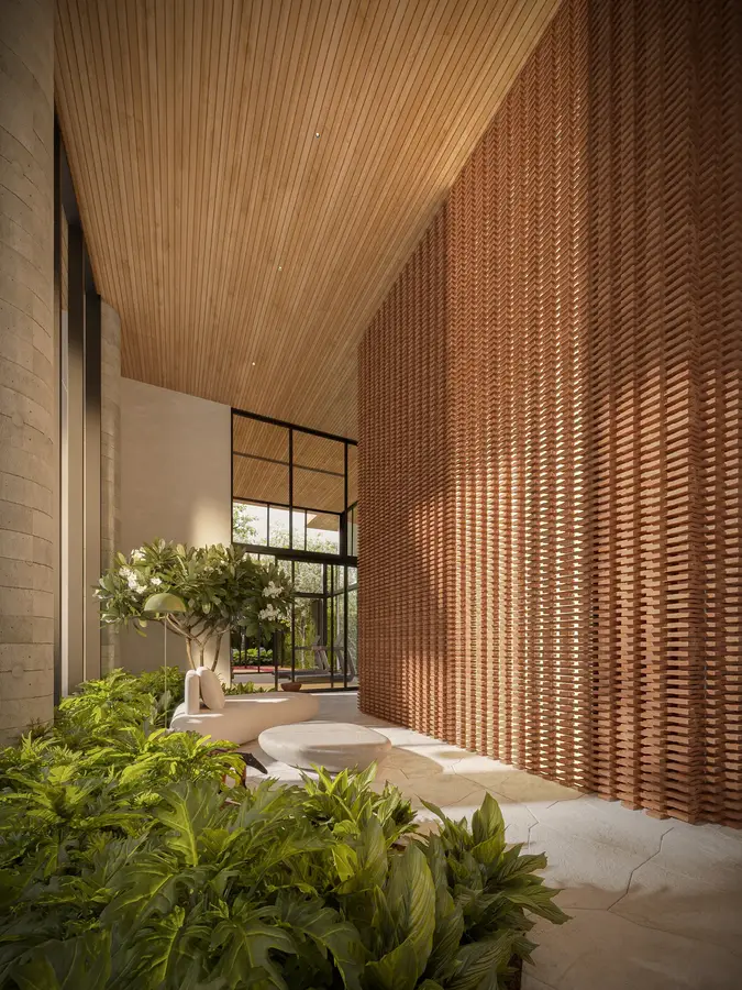 Hall de entrada com pé-direito duplo e painel cerâmico